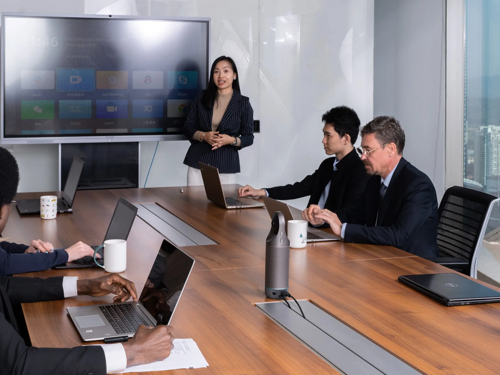 Meeting Pro 360 in a conference room, screen showing app icons